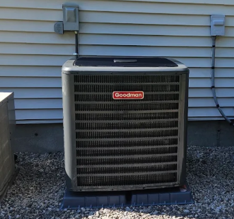 Goodman outdoor air-conditioning condenser installed on an equipment pad